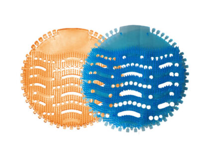 Two round urinal pads, orange and blue, next to each other