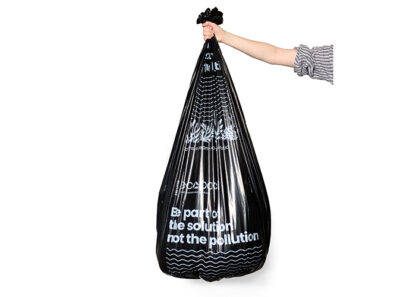 Full black rubbish bag held up by hand