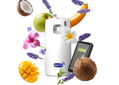 Airomist Deodoriser Dispenser surrounded by falling lavender, apple, frangipani flowers, mango and coconut